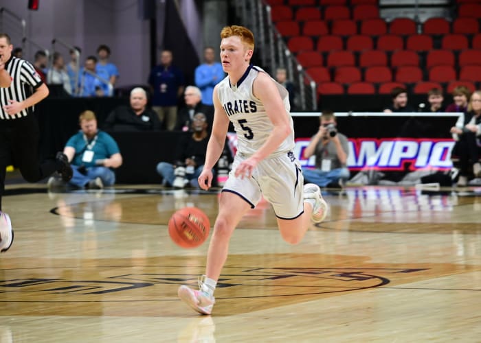 Hudson's Lyle Olsen moves the ball up the court in the Pirates' Class 2A quarterfinal win Tuesday morning. (Photo by Ryan Timmerman)